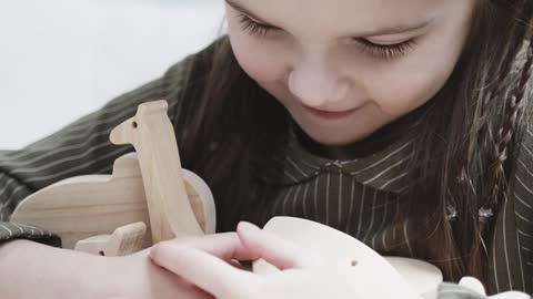 Kid playing with toys|