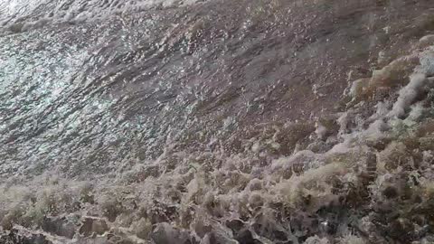 Creek floods roads in California