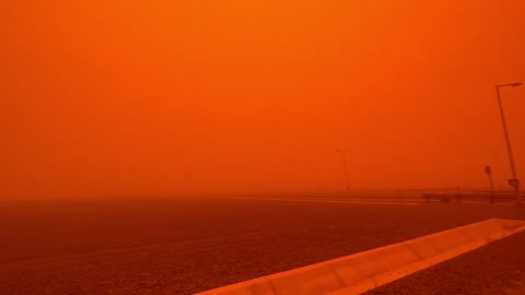 A Heavy Sandstorm Covering the Sky and Causing Everything to Turn Orange