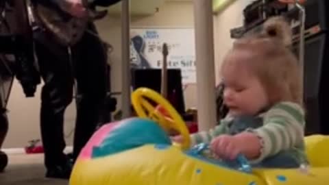 Toddler rocks out to dad's music