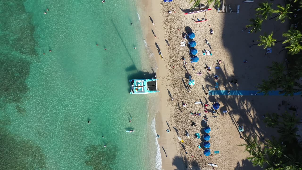 People Enjoying The Waikiki Beach In Hawaii