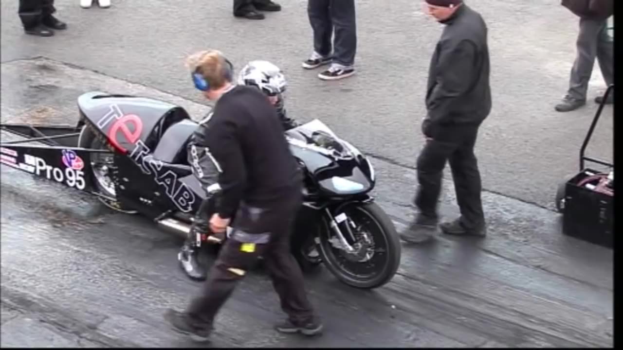 Girl 16 years old rides this super twin bike at Santa Pod Raceway.