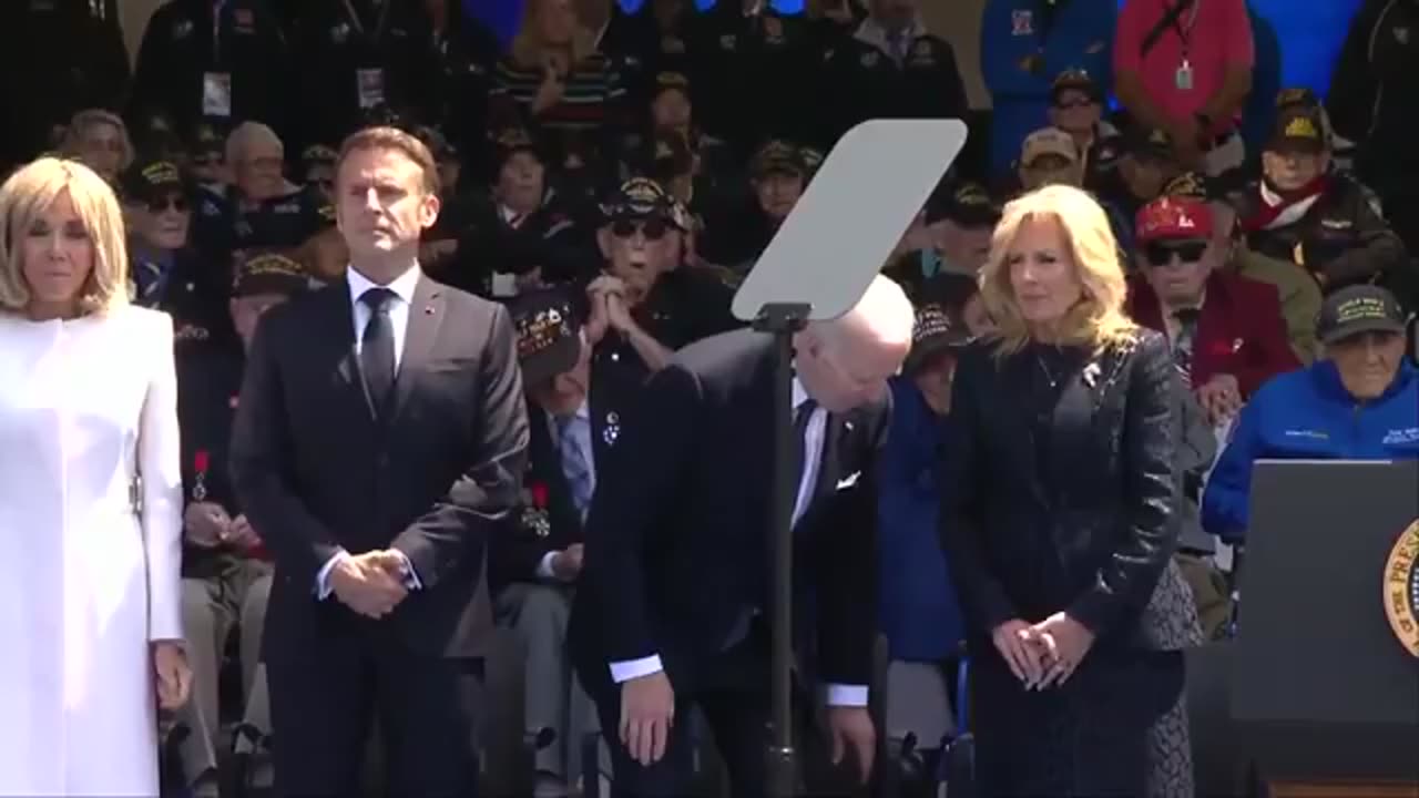 Biden seems confused when to sit during the D-Day Commemoration or did he soil himself?