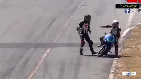 Two strange bikers fighting on the track in the middle of the race