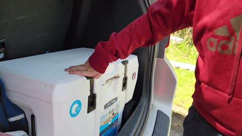 Kid Struggles to Open a Cooler