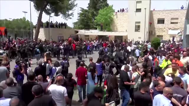 Police clash with mourners at Palestinian journalist's funeral