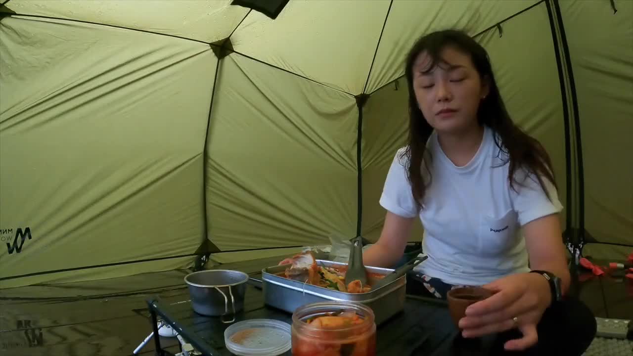 Camping outdoors in light rain. Camping time for rice farmers