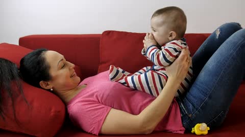 Mother with her excited baby
