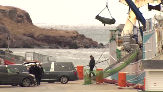 Survivors, bodies of sunken trawler crew arrive in Spain