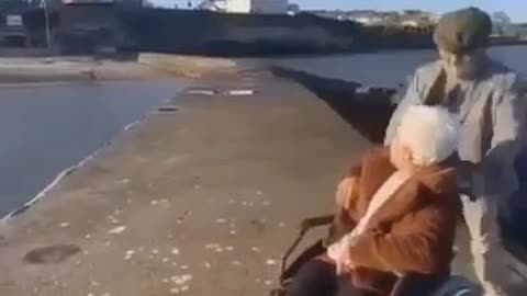An old man throws his partner into the valley