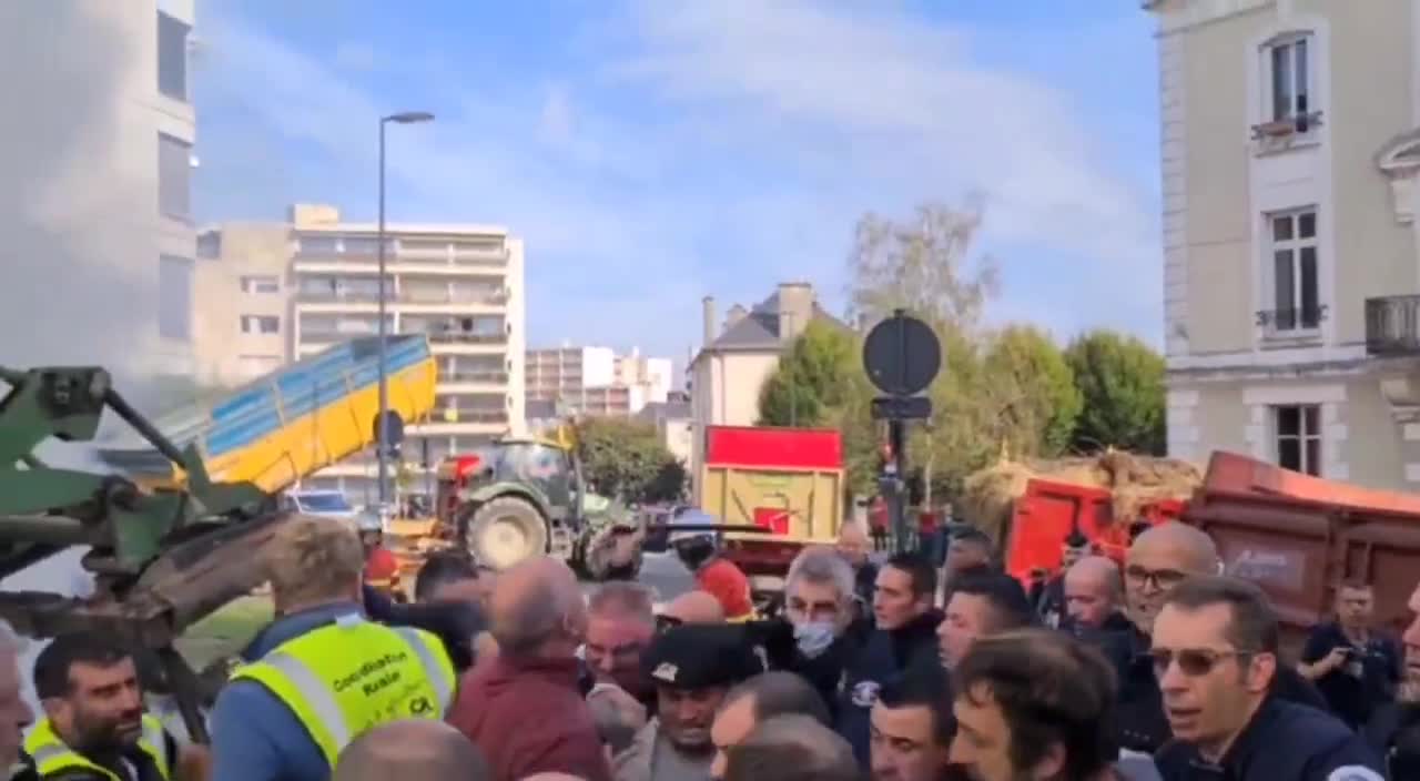 In Limoges, France, protesting farmers and the police dispersing them