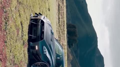 Gray Nissan GTR: Conquering the Heights in Breathtaking Mountain Terrain! 🏞️🚗