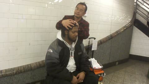 Luodong Massages Black Man In Subway Station