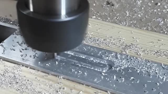 CNC Cutting into alumnium extrusion channel profile.