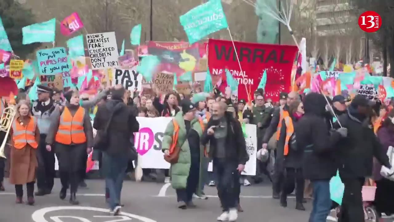 'Paid a pittance': UK teachers, parents and kids march over pay and conditions