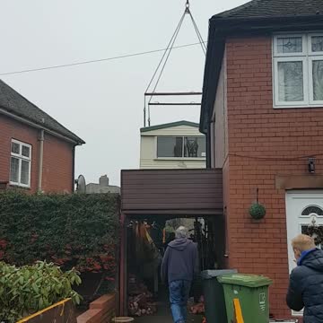 Static caravan being craned into position #6