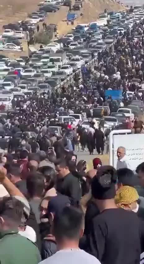 A huge crowd marches towards the Saqqez cemetery in Iran's Kurdistan province