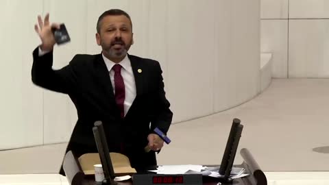 Turkish lawmaker smashes phone with hammer