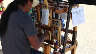 Man making a bracelet.