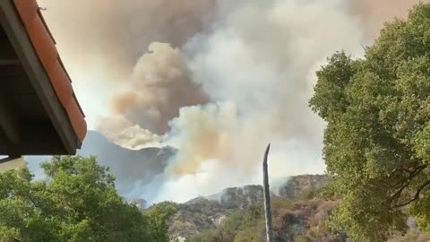 Huge Clouds of Smoke Rise Into Sky While Wildfire Spreads Rapidly Over California Hills