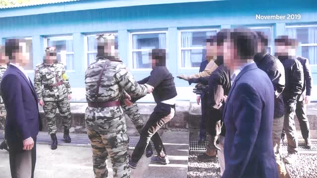 S.Korea releases photos of N.Koreans forced back