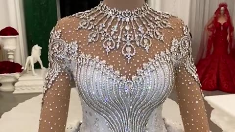 THIS STUNNING WEDDING DRESS WAS HANDMADE AND HAS OVER 200,000 CRYSTALS