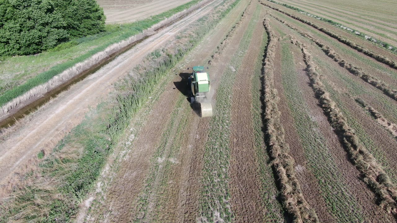 Drop bale then rise up and pan over to bluffs