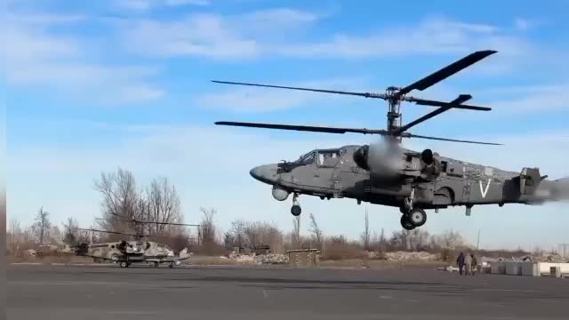 Russian Ka-52 firing on Ukrainian positions.