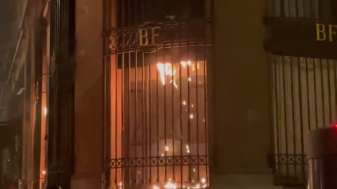 A building of the Banque de France begins to burn