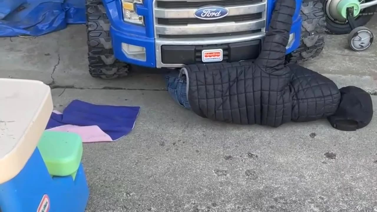 Mom Films Video Of Son Under Toy Car Pretending To Be A Mechanic