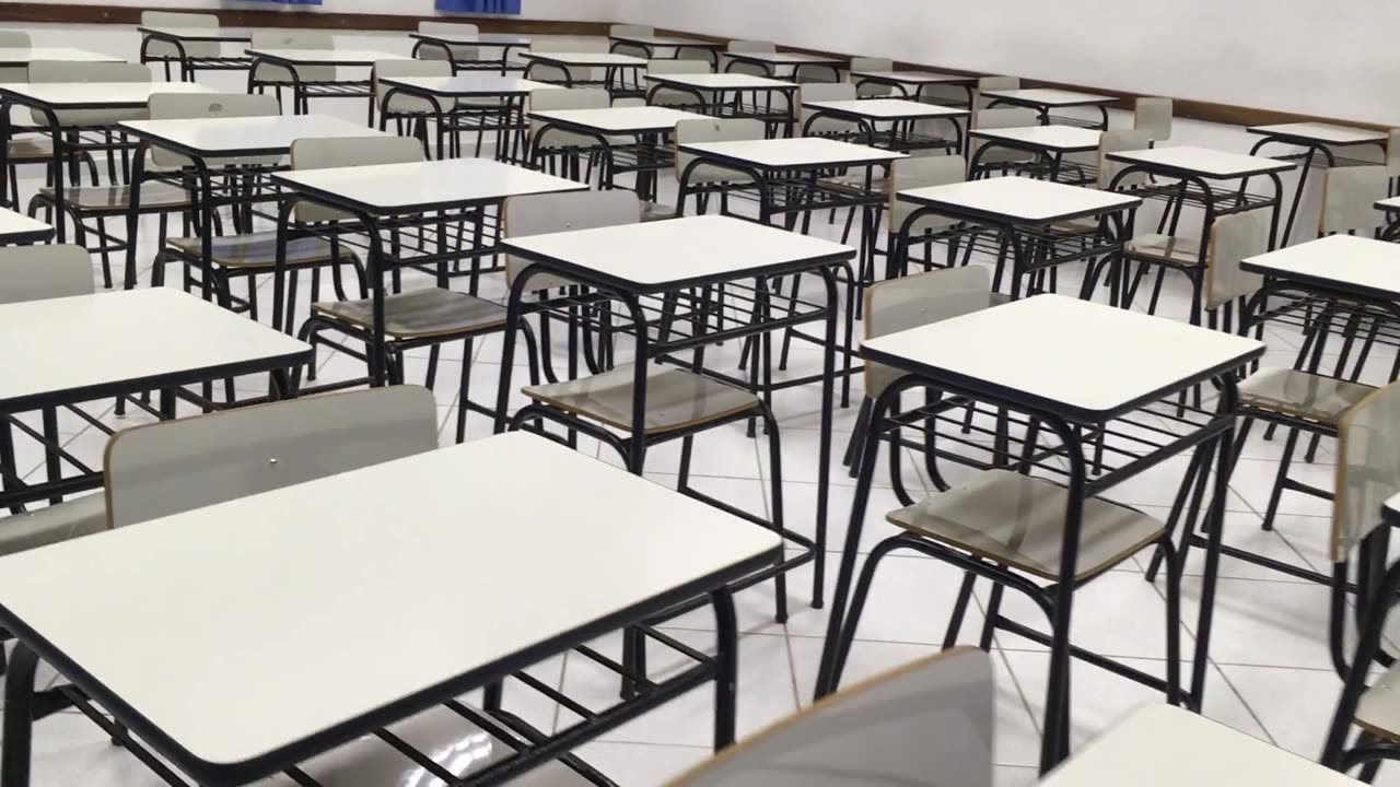 Students arrange their table and chair in manner