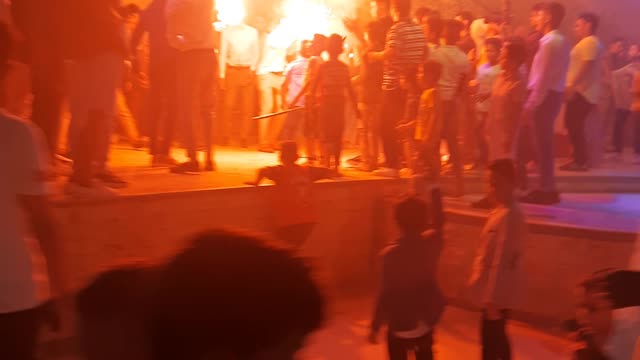 Groom Friends dance with fireworks in wedding