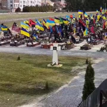 Lviv (Lwow), Western Ukraine cemetery displays Ukrainian flags and Red & Black flags