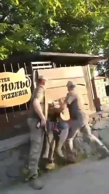 Thugs in military uniform simply catch people on the street