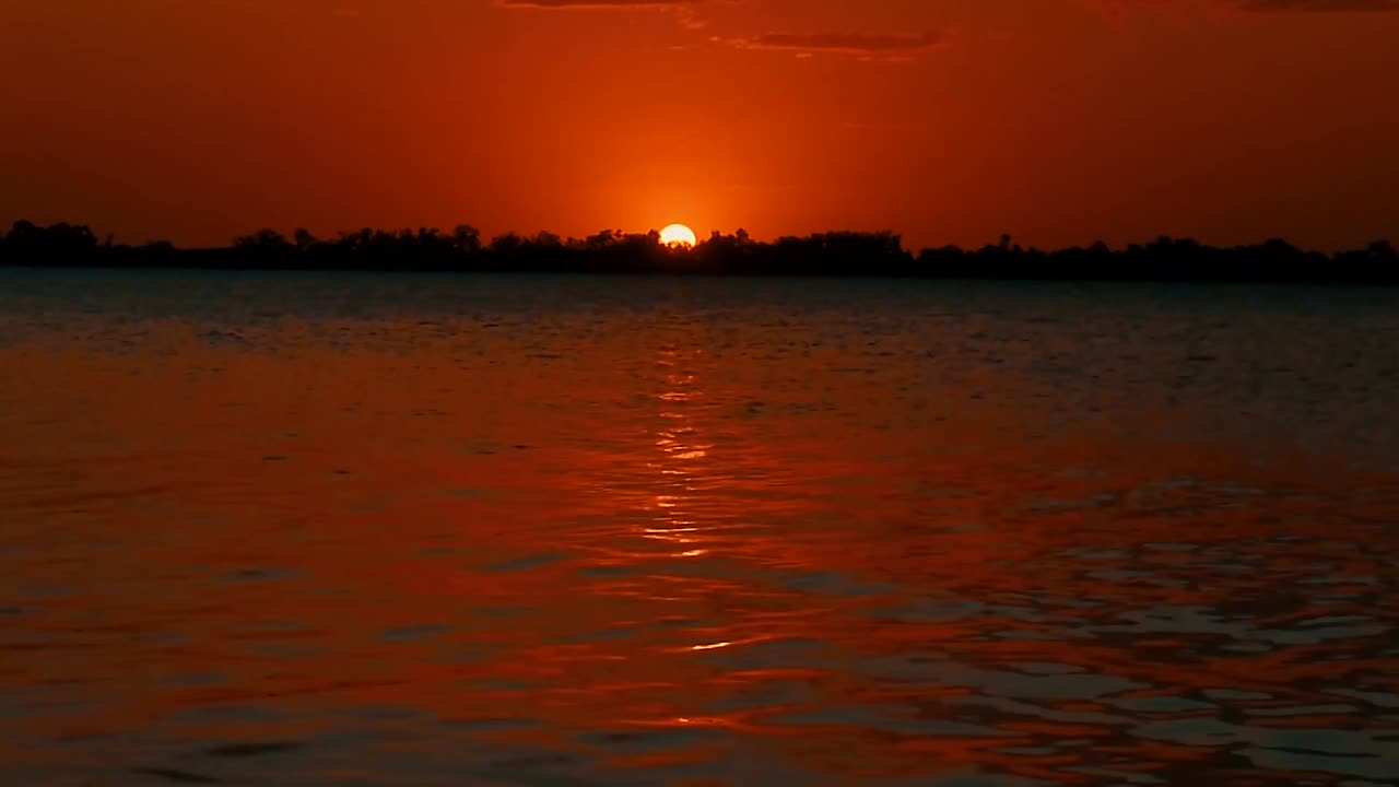 Sunset over lapping water