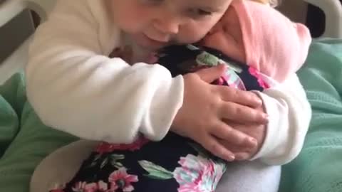 3-Year-old girl meets.her baby sister for the first time