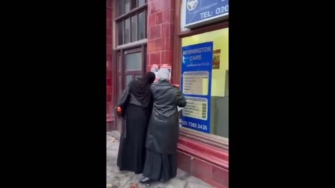 Women Pull Down Missing Isreali Flyers