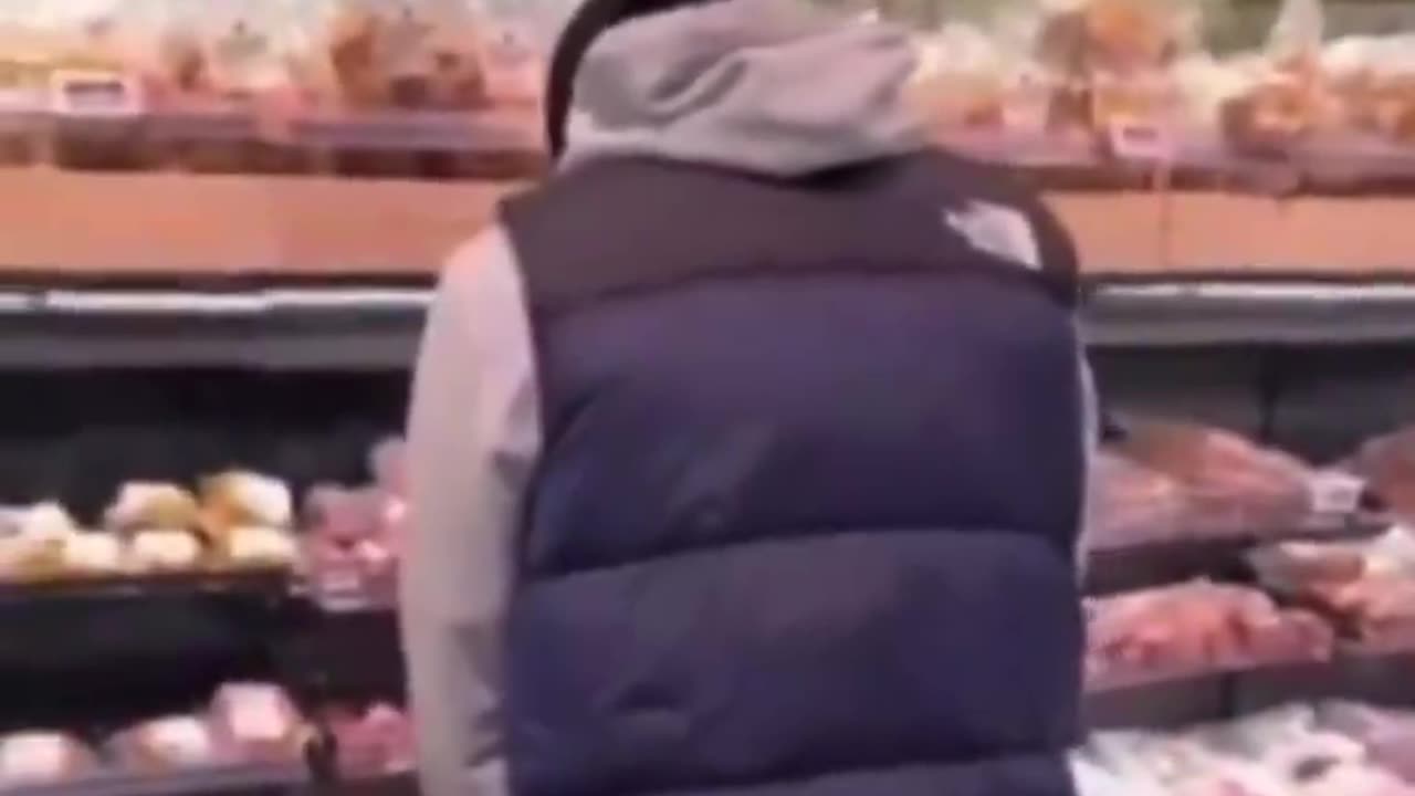 Young Islamist in the Netherlands urinates on the pork section of a supermarket