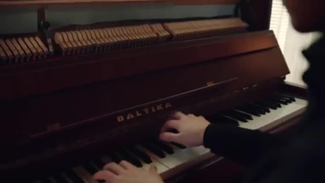 Playing piano.