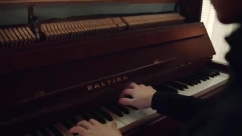 Playing piano.