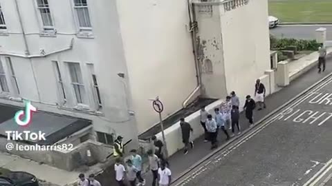 Illegal immigrant hordes outside a taxpayer-funded hotel in Folkestone.