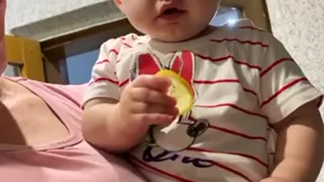 Child eating lemon