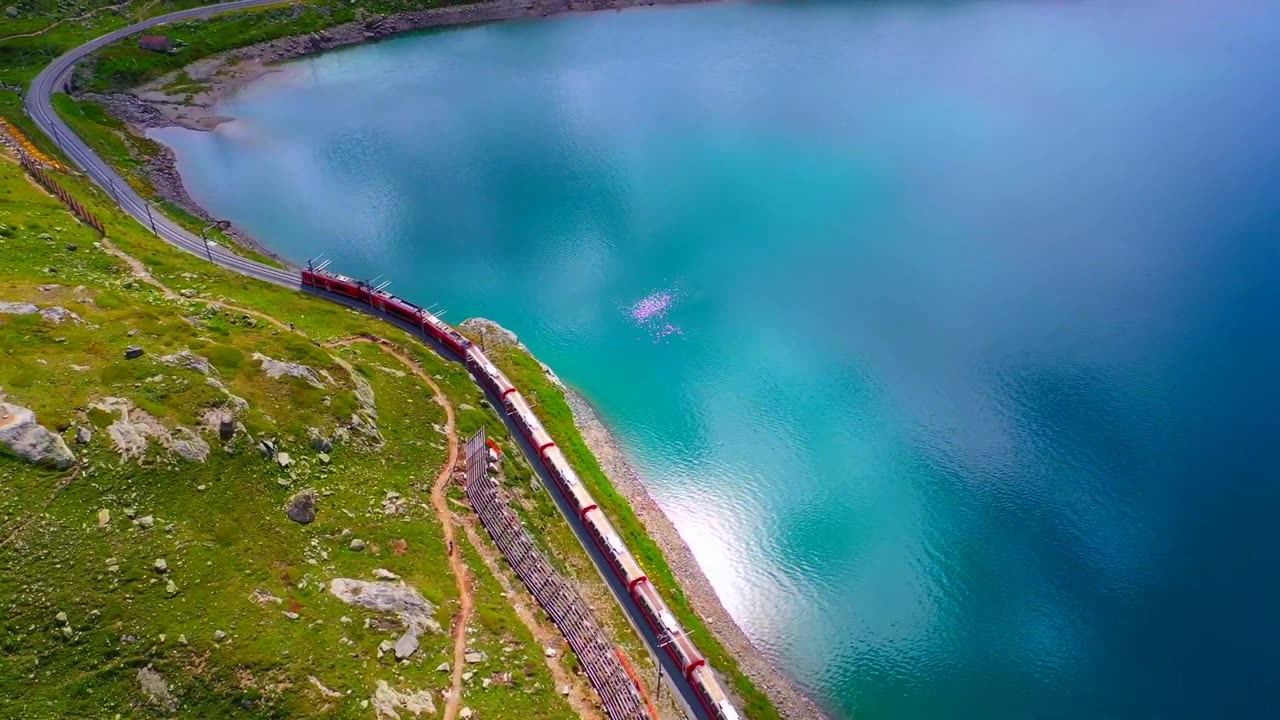 Train Amidst the Beauty of Switzerland: Drone Footage Showcasing Stunning Landscapes