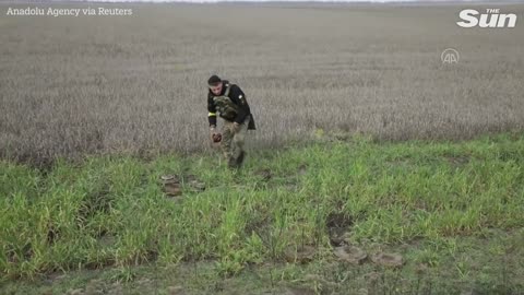 Ukrainian mine disposal team work to uncover and clear mines in Mykolaiv