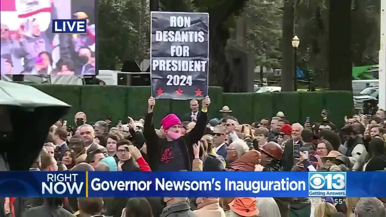 Newsom Inauguration Crowd Rips Sign Away From DeSantis Supporter