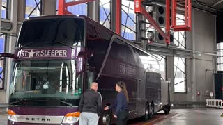 Bus and Trailer Being Turned Around by Large Lift