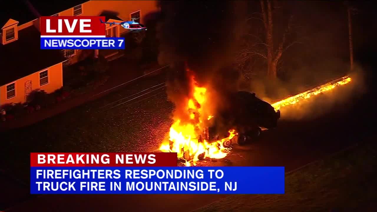 Flames engulf garbage truck in Mountainside residential neighborhood