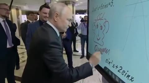 putin draws an unusual smiley face on an electric whiteboard in mascow