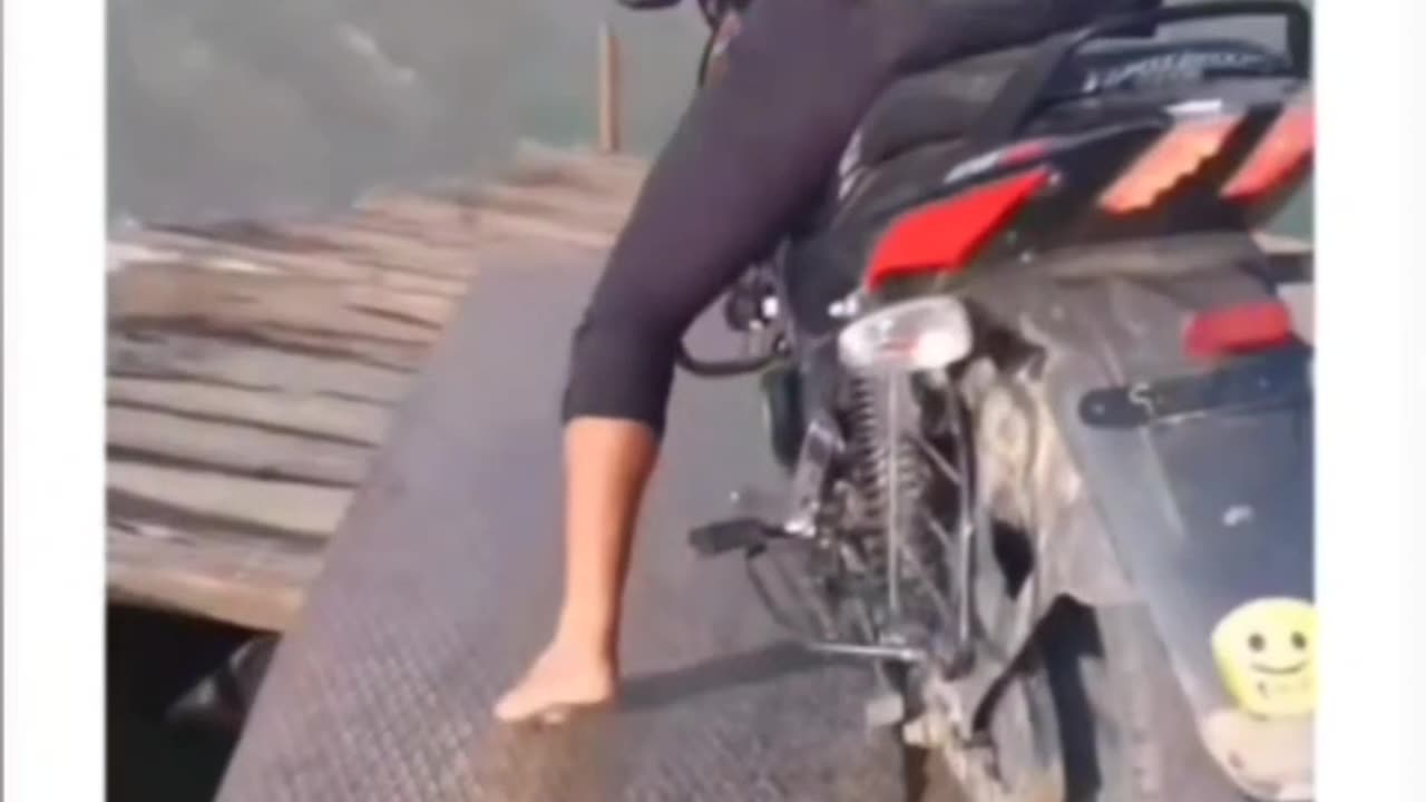 Crazy Indian boy riding bike in ocean