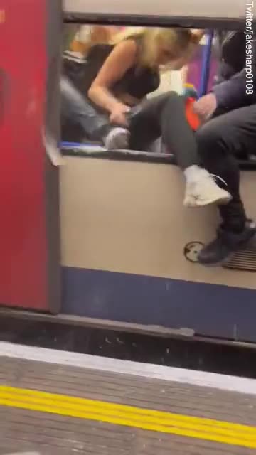 Commuters smash tube windows after carriages fill with smoke